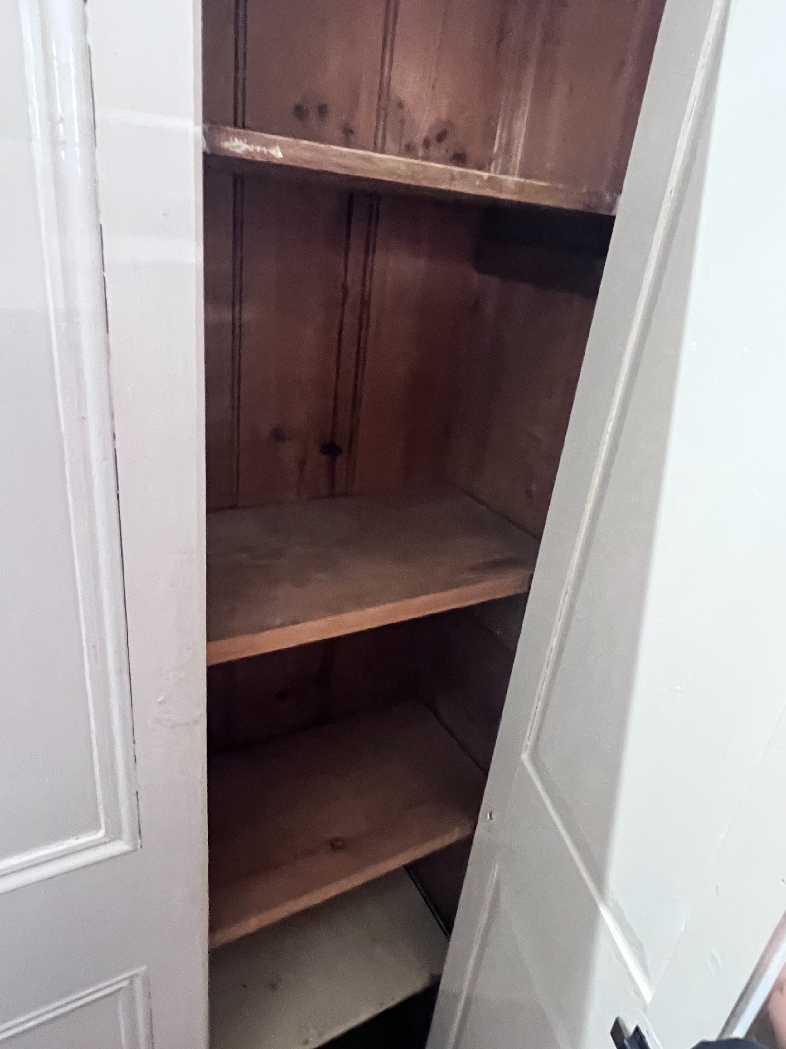 A white painted pine housekeeper's cupboard, width 99cm, height 210cm *Please note the sale commences at 9am.